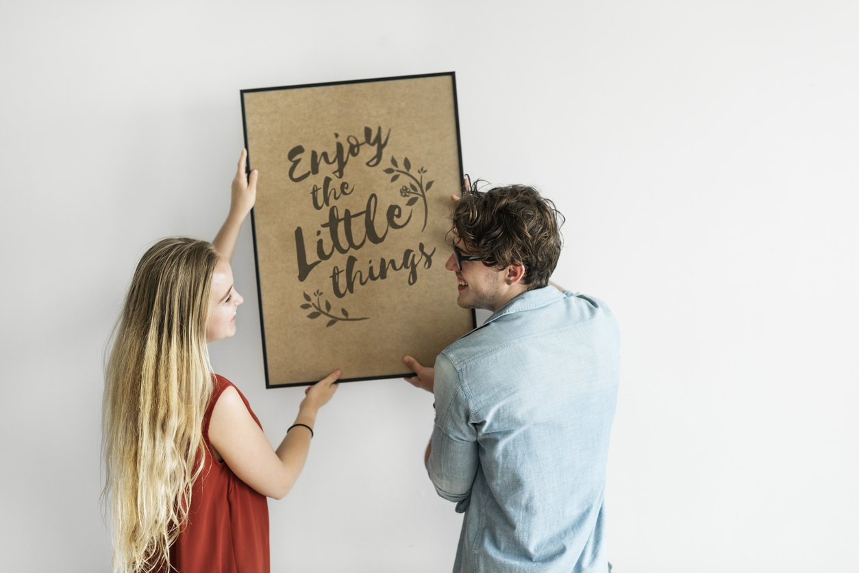 frame, art, hanging, couple, first apartment, charles at bexley, columbus, ohio